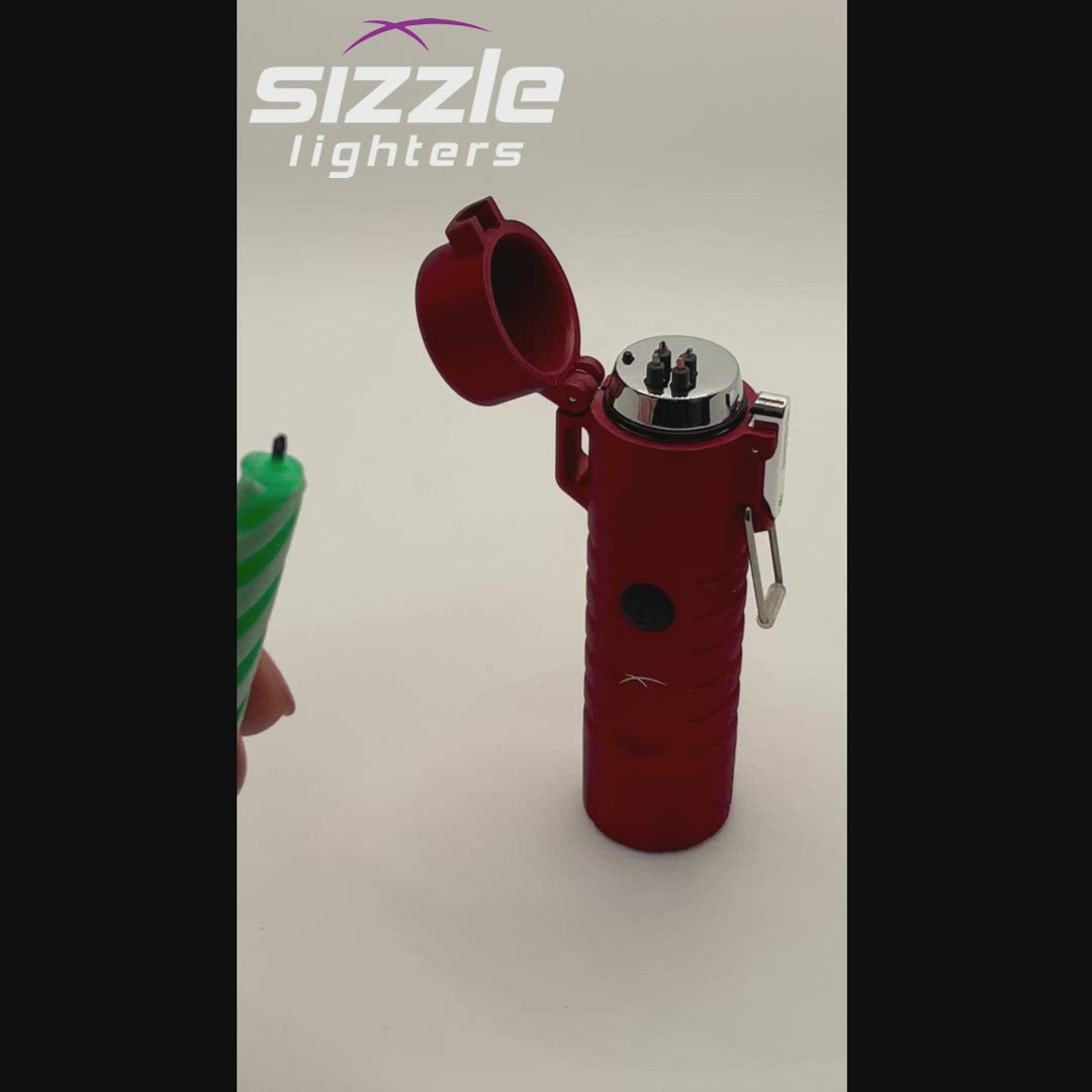 Sizzle Survival USB rechargeable lighter/flashlight in red waterproof casing lighting a green and white birthday candle