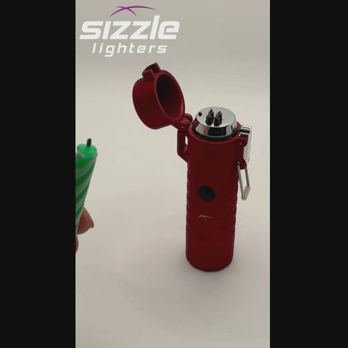 Sizzle Survival USB rechargeable lighter/flashlight in red waterproof casing lighting a green and white birthday candle